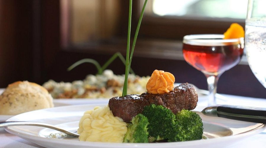 The Bottle signature dishes Jumbo Lump Maryland Style Crab Cakes, Veal Chops, Lamb Racks, Hereford Choice Beef